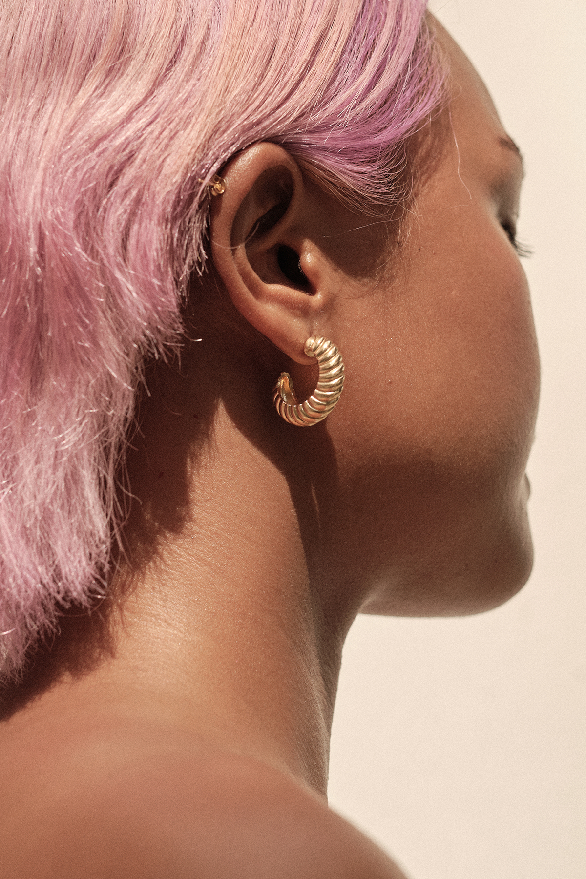 Side view of Pyar Saturn Gold Stud Hoop Earring, available on ZERRIN with free local Singapore shipping 