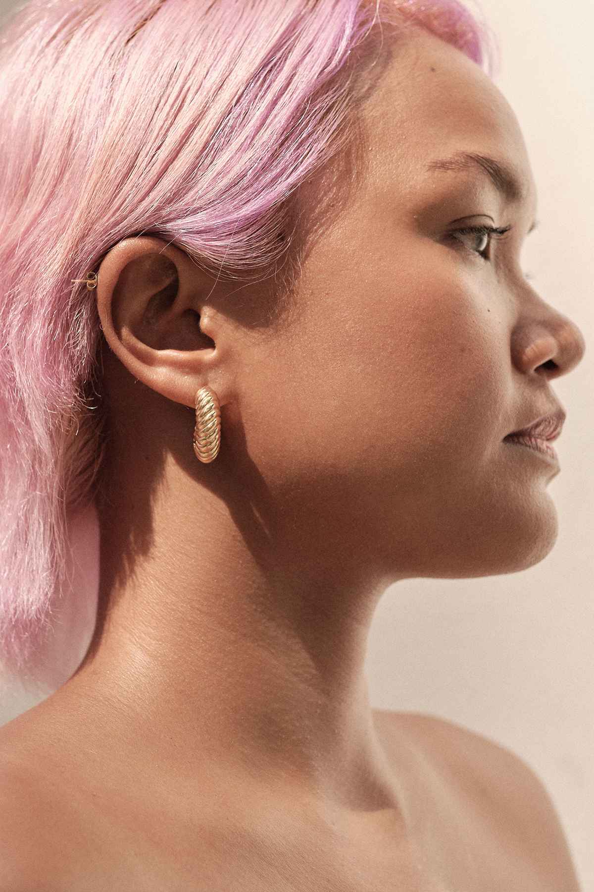 Side view of Pyar Saturn Gold Stud Hoop Earring, available on ZERRIN with free local Singapore shipping 