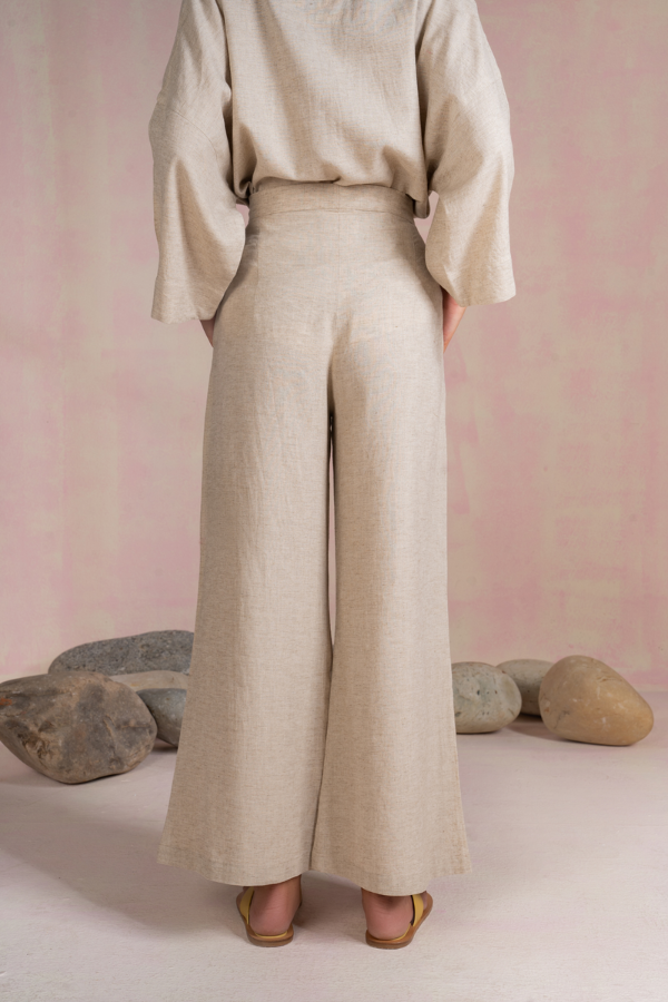 Back view of Sui's The Island Linen Wide Leg Trousers, available on ZERRIN with free Singapore delivery